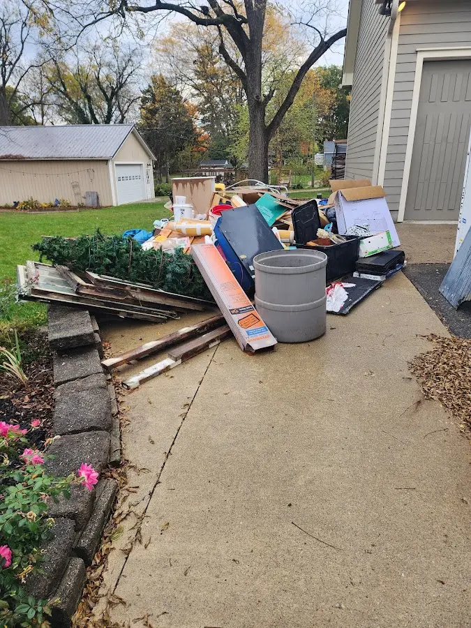 Dumpster being loaded with debris for 30 Yard Dumpster Rental in Riverdale